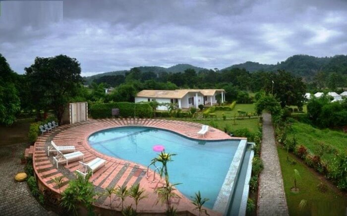 huge outdoor pool in the premises of a resort