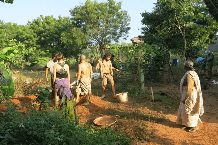 volunteers helping locals in a farm