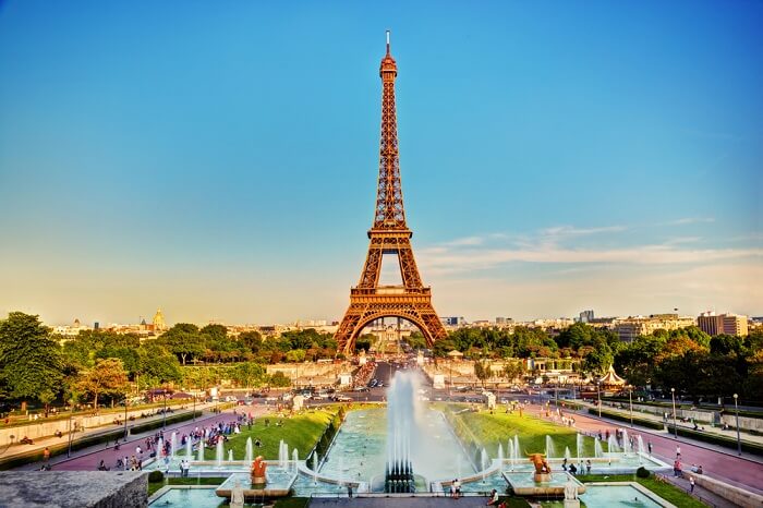 Eiffel Tower seen from fountain at Jardins du Trocadero at a sunny summer day in Paris