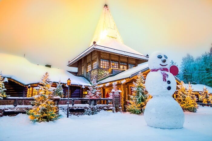 A snow-covered house and street at the Santa Claus village of Rovaniemi