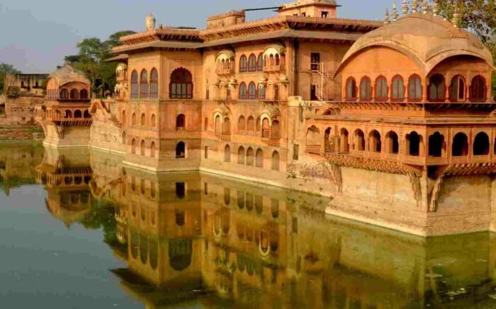 A view of Deeg Palace surrounded by water in Rajasthan