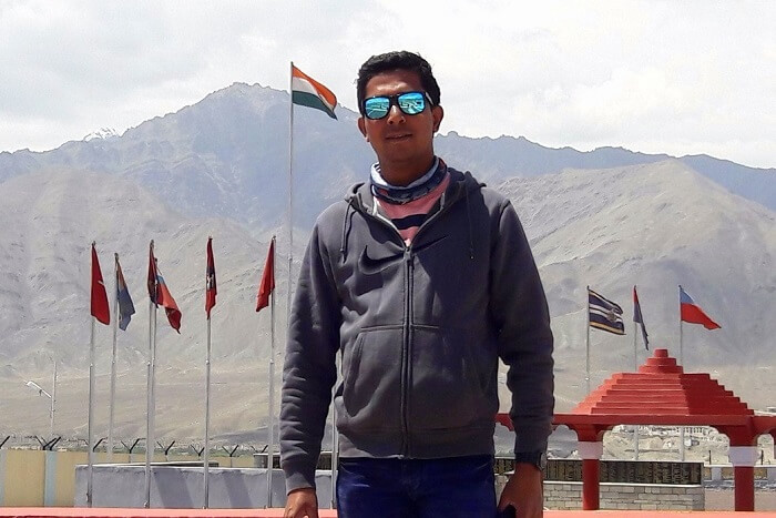 ninad posing outside war memorial ladakh