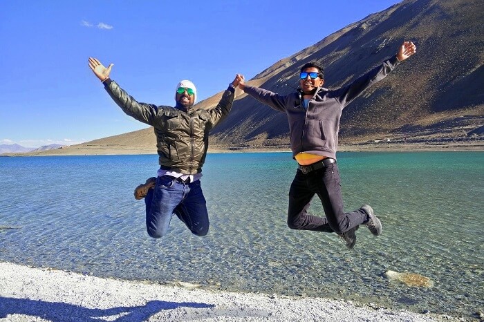 ninad and friend jumping near pangong lake