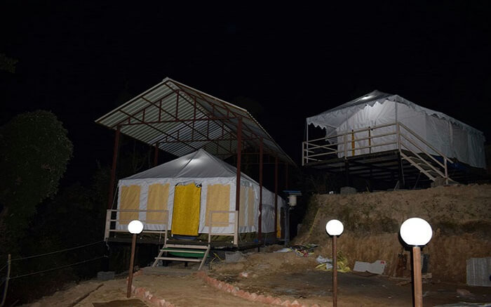 Tents in mountains at night