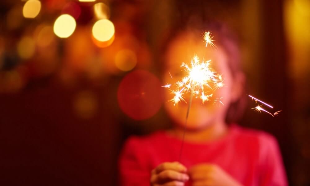 a kid burning sparkle
