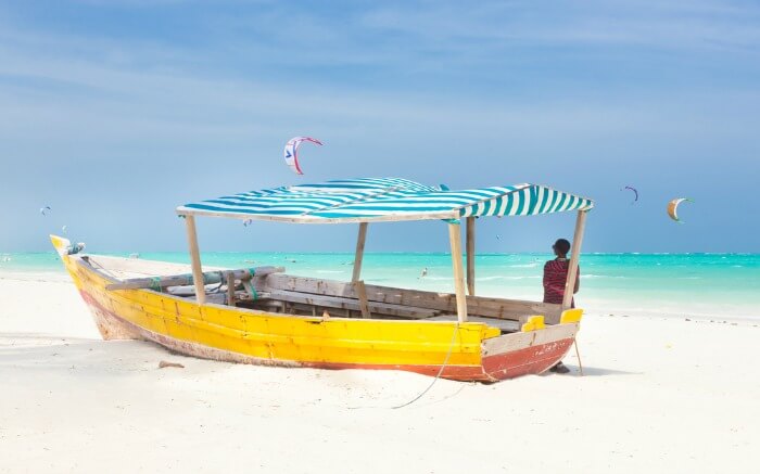 a traditional colorful boat at sea shore in Kenya