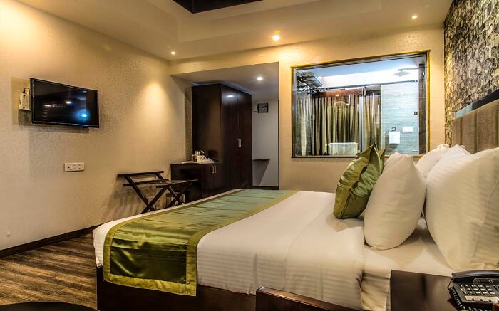 A lavishing resort room with tv