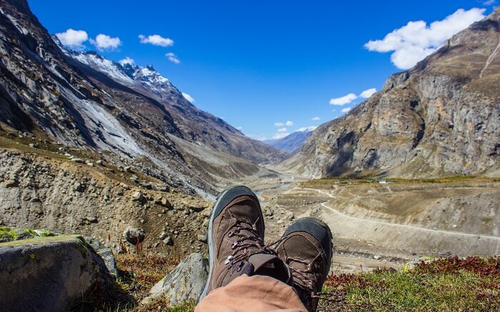 A man resting during hiking near Hampta Pass Trek