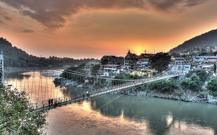 A view of a bridge in Rishikesh at sunrise