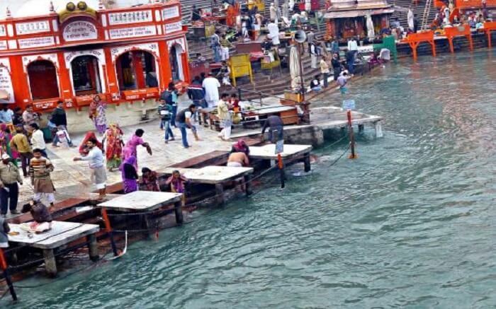 Devotees taking a holy bath at Gau Ghat in Haridwar