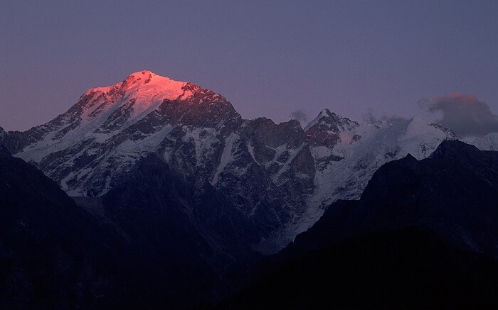 Light of sun on a snow clad peak