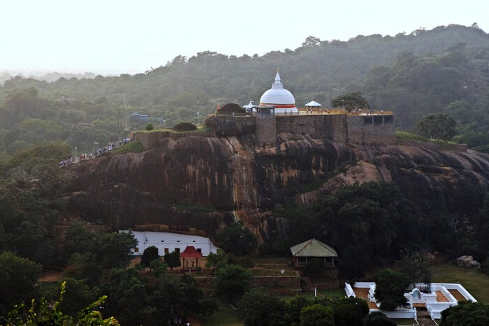 Seek blessings at the rock-cut monastery of Sithulpawwa