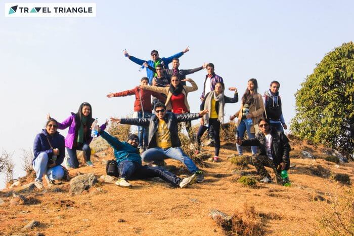 a group of people enjoying happily in hills