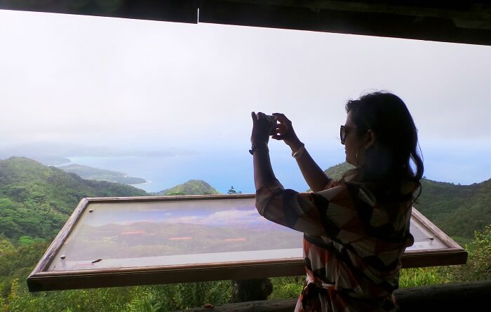 Woman clicking a picture in Seychelles