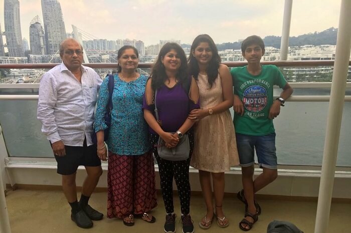 saurabhi singapore family trip: family posing before views from cruise