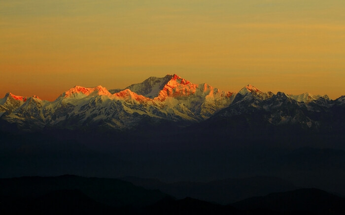 The breathtaking sunrise over the horizon of Khangchendzonga