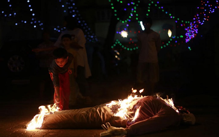 A child burning an effigy in Goa on the Christmas eve