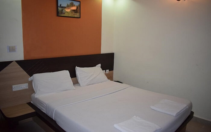 A hotel room in Pondicherry with akind size bed