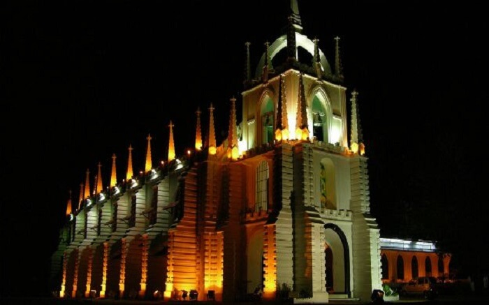 A well-lit church in Goa at night