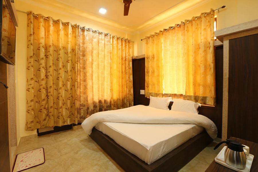 a hotel room with a king size bed
