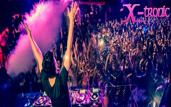 Party lovers dancing to the tune of a DJ in Xtronic Club & Lounge Bar in Chandigarh