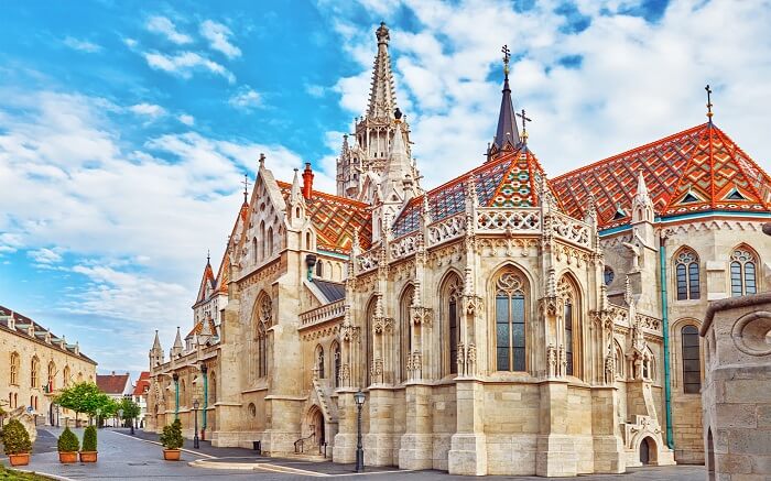 a gothic style church with red terrace