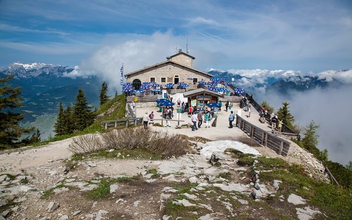 hitler’s eagles nest on a cliff surrounded by mountains