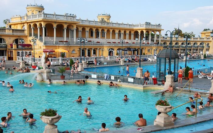 people enjoying hot bath in a spa pool