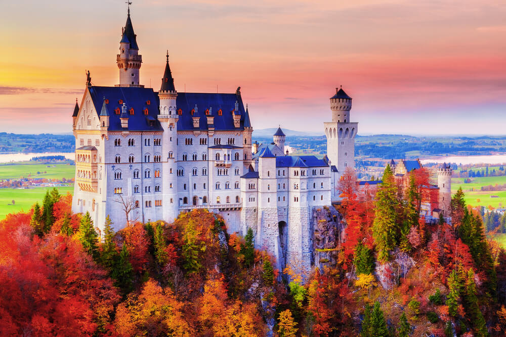 a gorgeous castle amid colourful trees