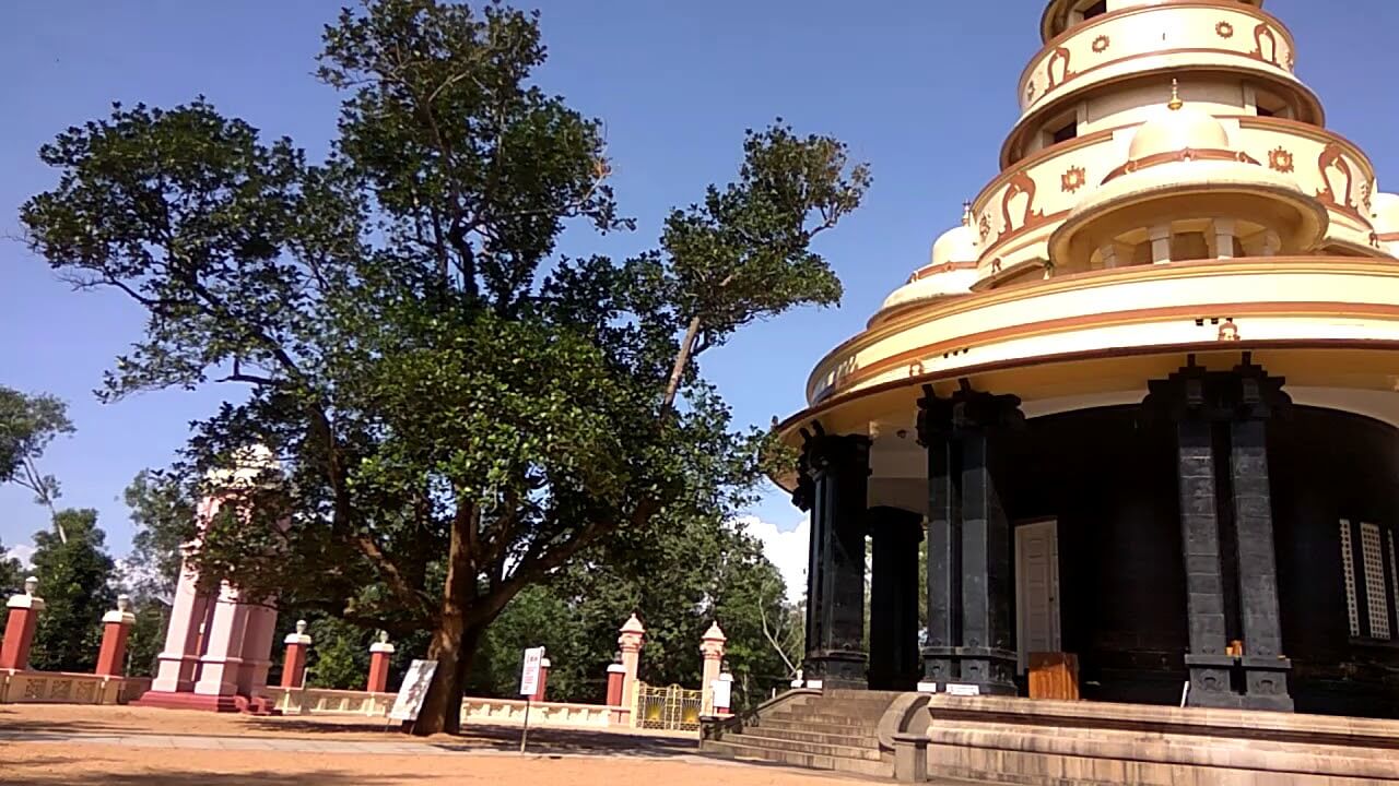 a huge temple with many trees around