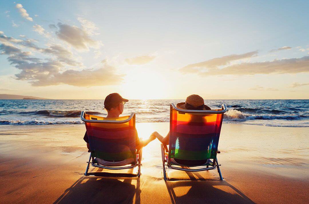 a couple sitting on beach