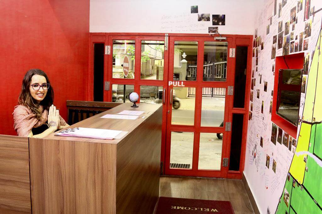 a lady at reception in lollipop hostel