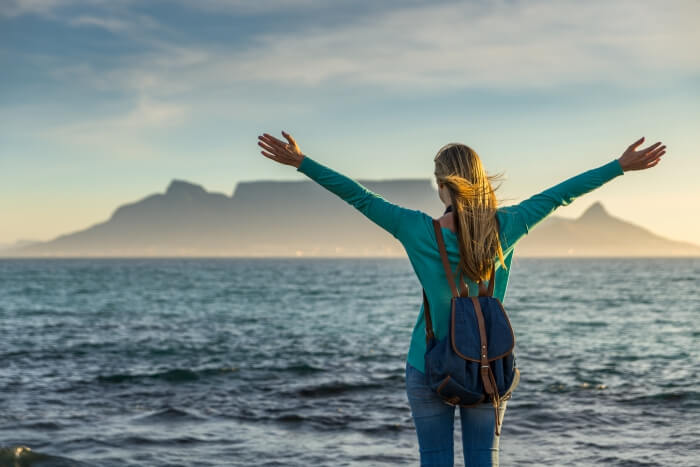 A girl posing in front of Table Mountain in Cape Town