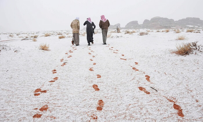 Snowfall In Saudi Arabia Covers Sand Dunes In The Desert