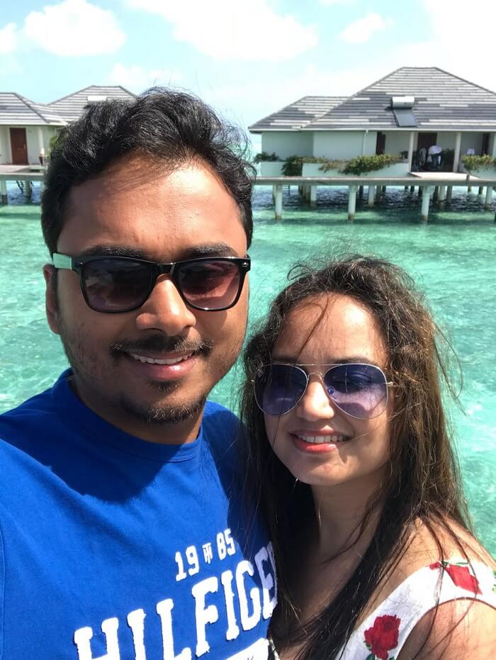 nihal and his wife at the water villa at sun island