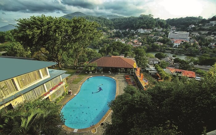 a grand outdoor pool of a hotel