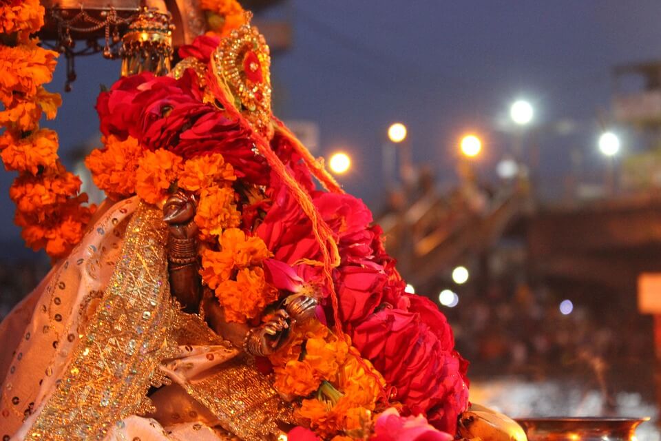 statue of a deity covered in colorful clothes
