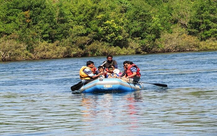 Tourists on blue waters doing river rafting