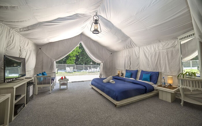 a gorgeous blue bed in a tent style Ahsan Mount Resort