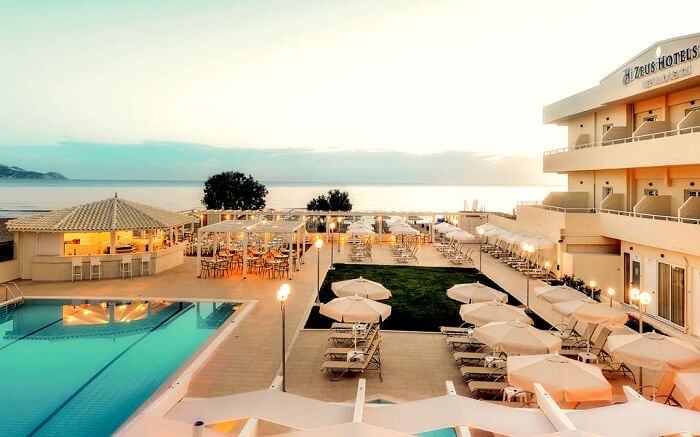a luxury resort with a grand pool and sitting area