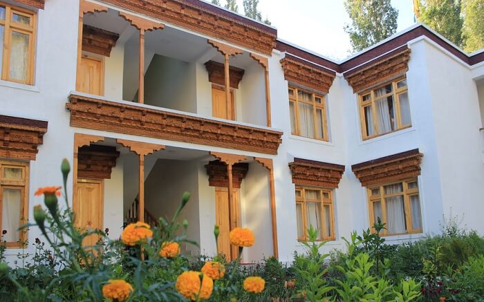 carved wooden door and window panels of Hunder Resort