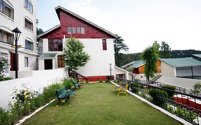 red and white Vardaan Resort Patnitop in mountains