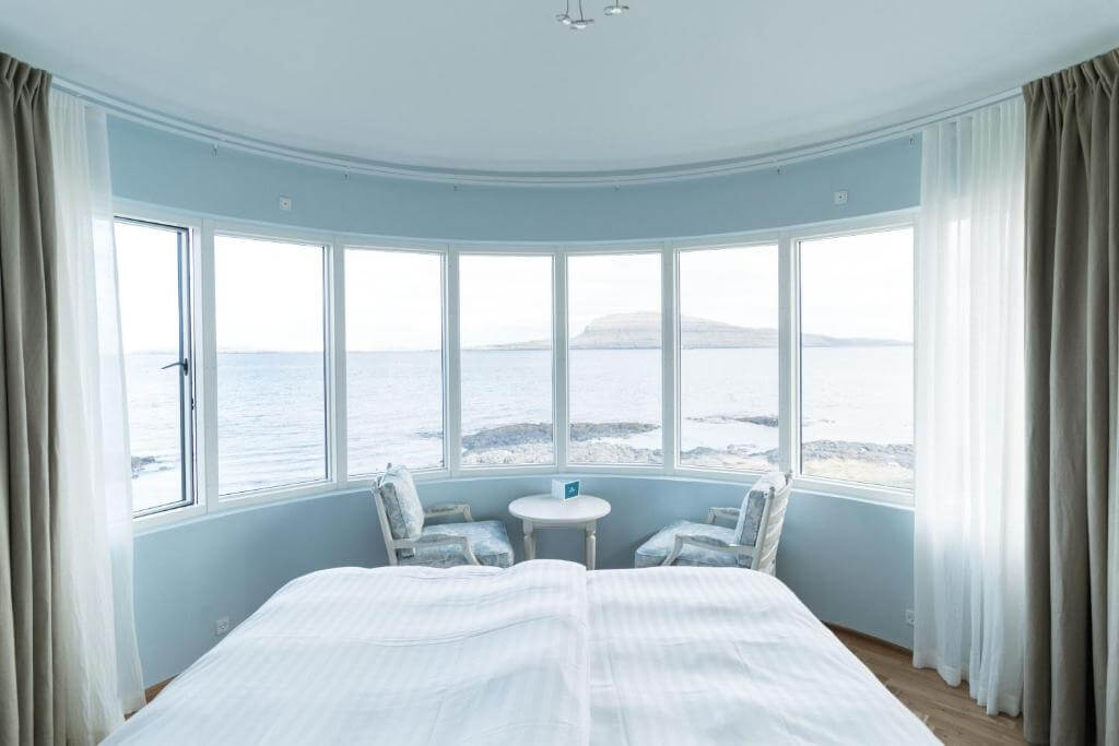 a hotel room with glass windows