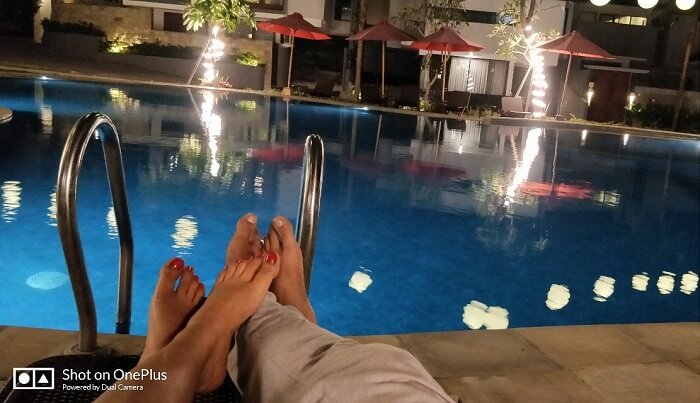 Couple relaxing by the pool