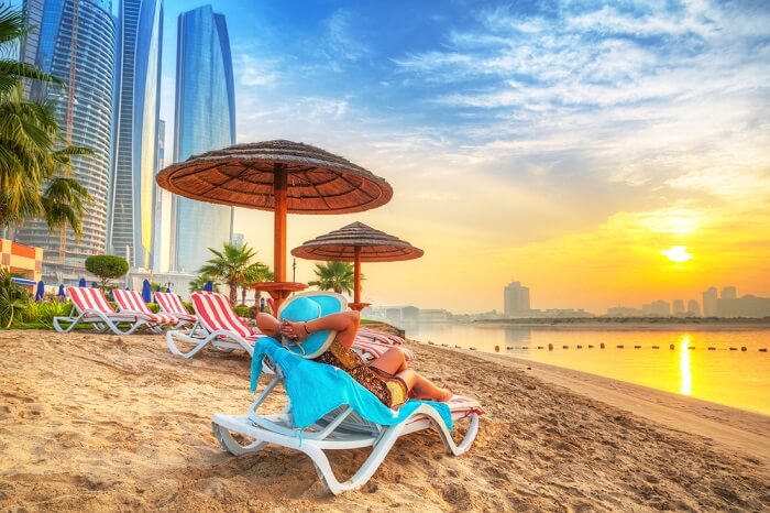 woman relaxing on abu dhabi beach