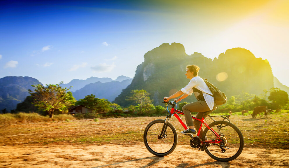 person riding bicycle in laos