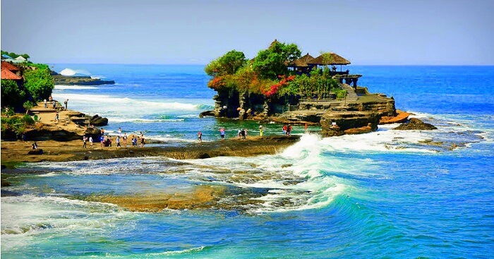 waves crashing across the shore of the temple