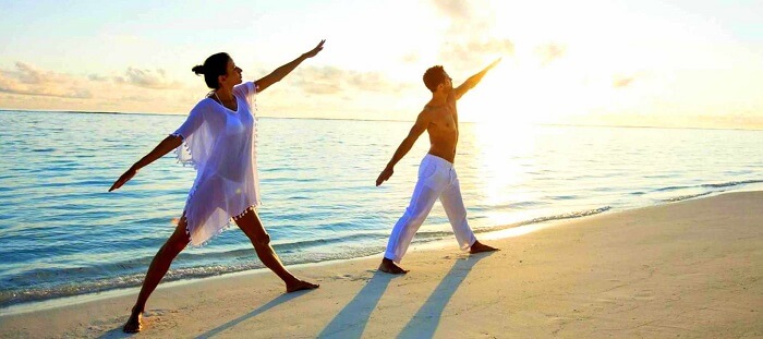 morning yoga session couple