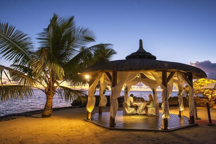 couple enjoying dinner by the sea