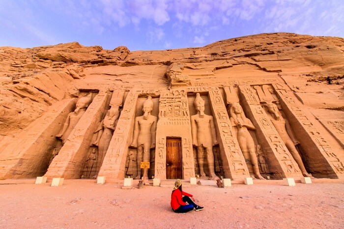 Girl sitting in front of Abu Simbel temples